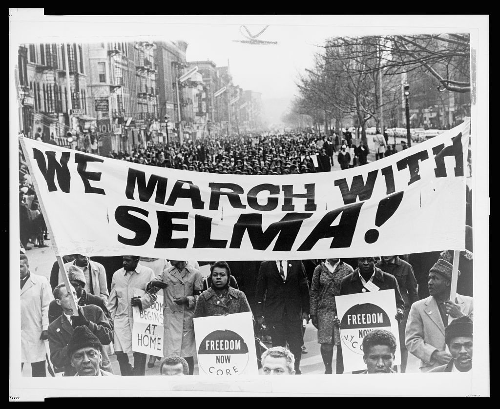 A march of 15,000 in Harlem in solidarity with Selma voting rights struggle. World Telegram & Sun photo by Stanley Wolfson. Library of Congress.