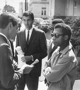 Howard Zinn and James Baldwin speak with the media on Freedom Day in October, 1963.