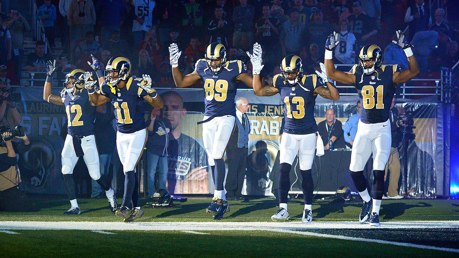 Nov 30, 2014; St. Louis, MO, USA; St. Louis Rams wide receiver Stedman Bailey (12) and wide receiver Tavon Austin (11) and tight end Jared Cook (89) and wide receiver Chris Givens (13) and wide receiver Kenny Britt (81) put their hands up to show support for Michael Brown before a game against the Oakland Raiders at the Edward Jones Dome. Mandatory Credit: Jeff Curry-USA TODAY Sports